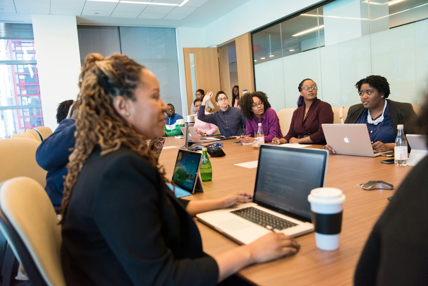 Adults taking part in a workshop around a conference table